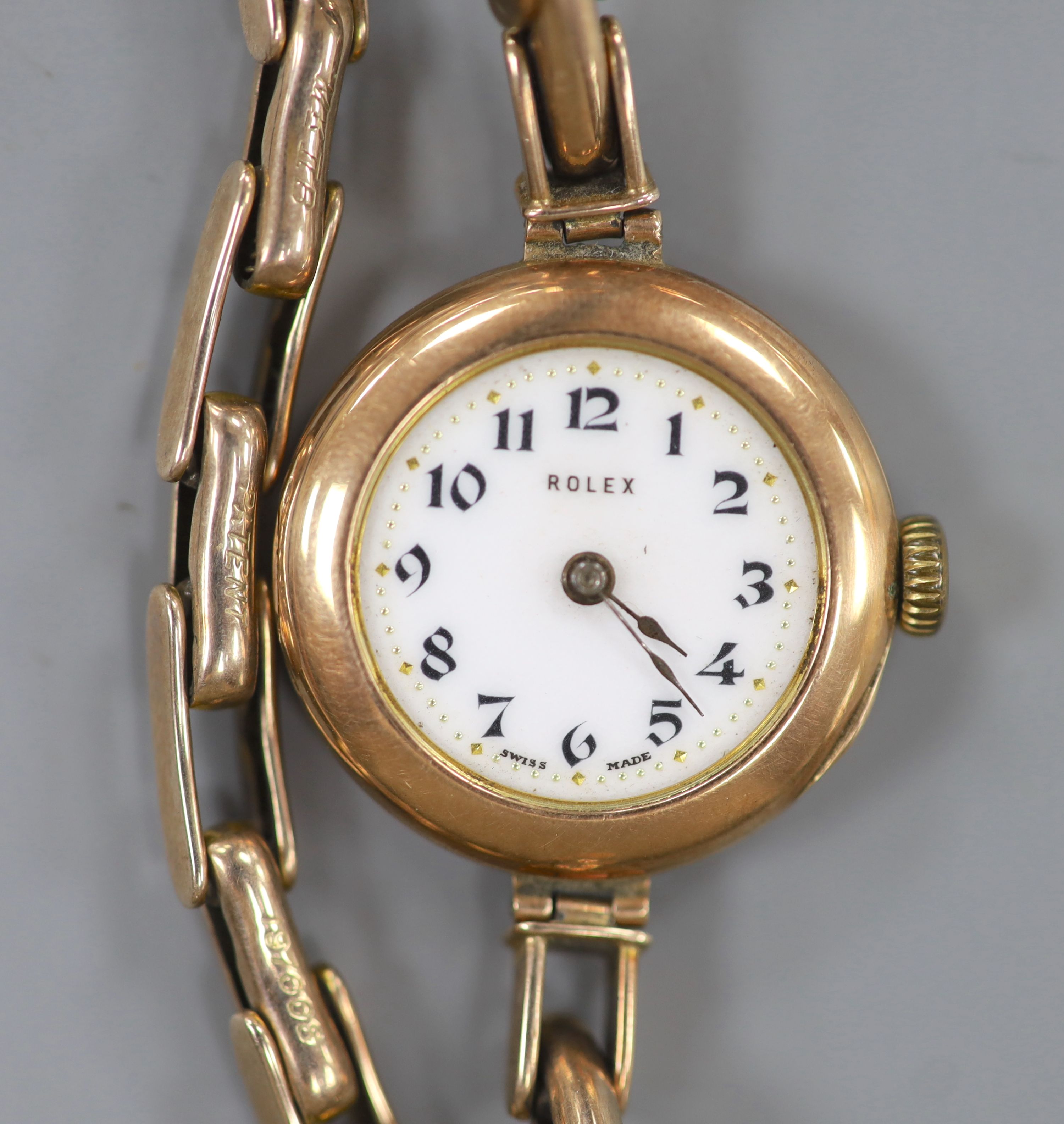 A lady's early 20th century 9ct gold Rolex manual wind wrist watch, on a 9ct flexible bracelet (no glass)